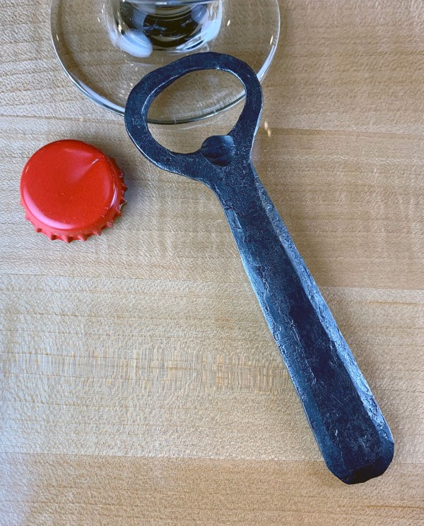 Rounded church key bottle opener