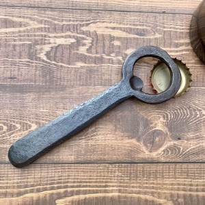 hand-forged church key bottle opener with rounded handle