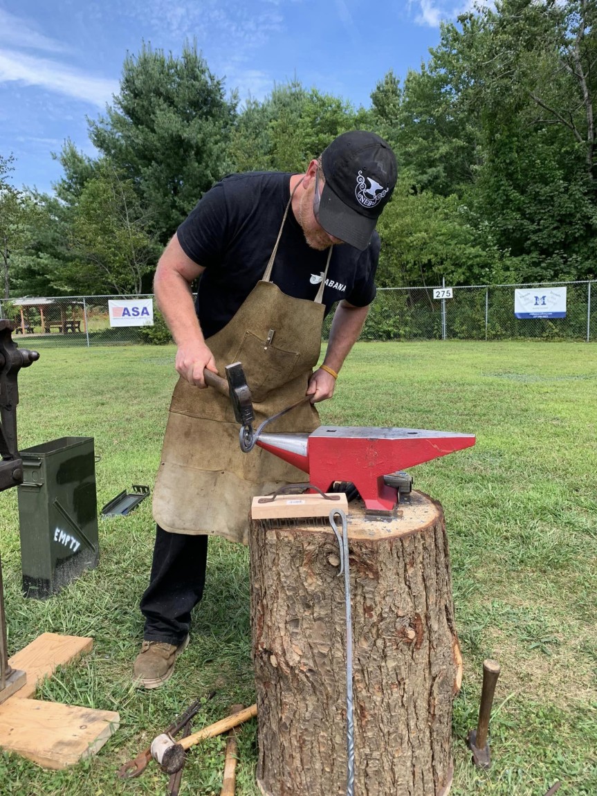 Me doing a blacksmithing demo at a local craft fair.